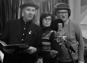 Trev, Simon and Sophie recording a previous episode in classy black and white